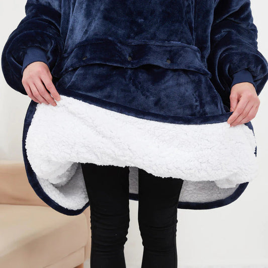 Close-up of the soft black plush fabric on the heated hoodie blanket